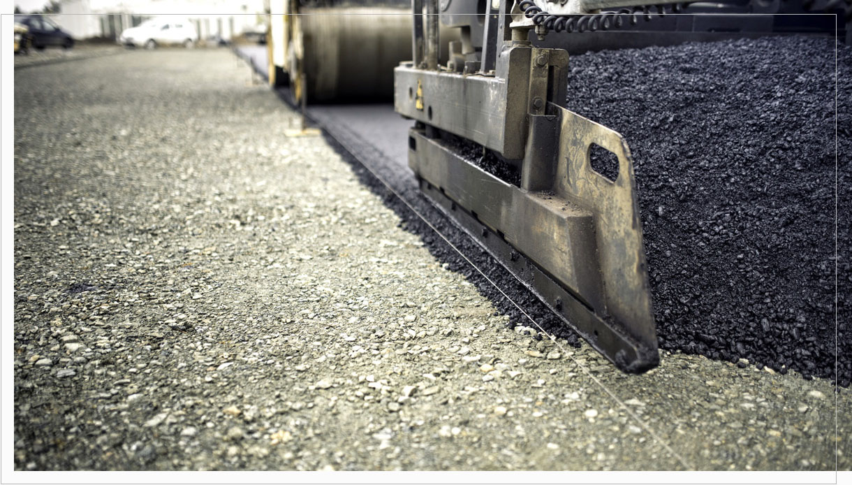 industrial pavement truck laying fresh asphalt, bitumen during r